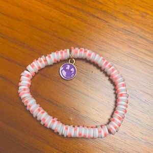 Clay bead bracelet. With purple smiley face